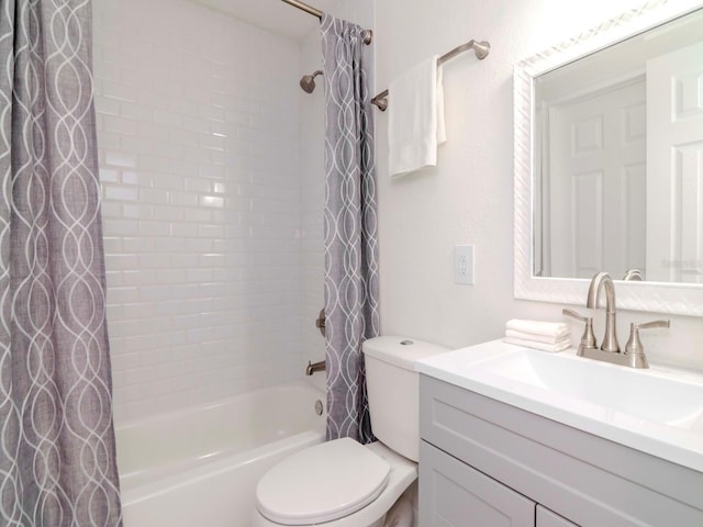 bathroom featuring toilet, shower / bath combo, and vanity