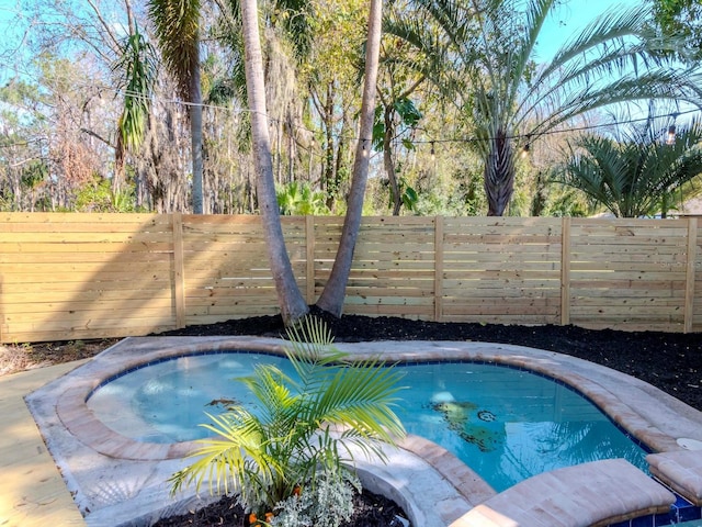 view of pool featuring a fenced backyard