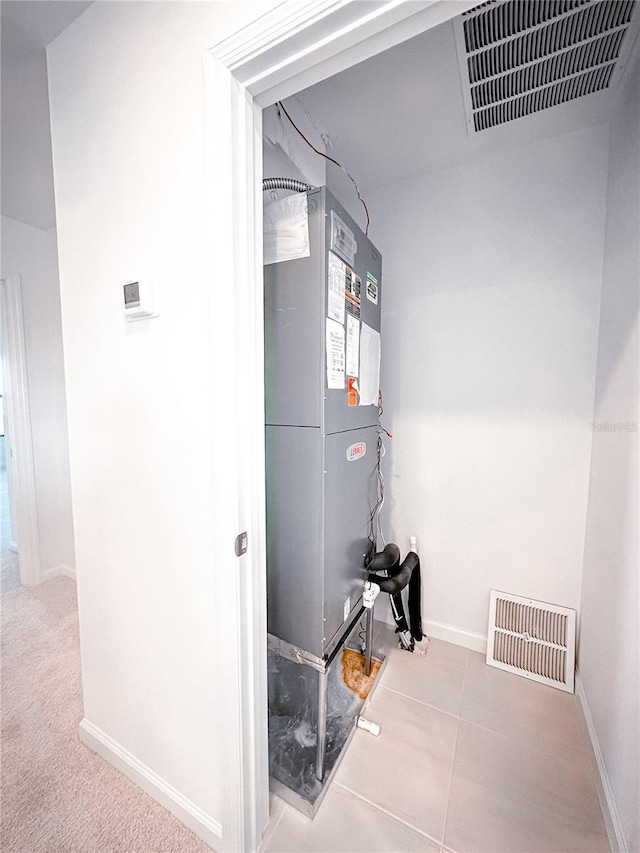 utility room with visible vents and heating unit