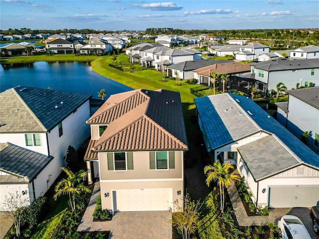 bird's eye view with a residential view and a water view