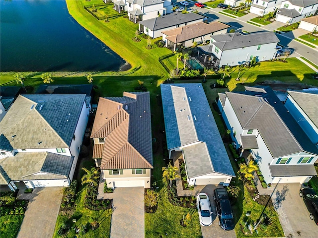 bird's eye view featuring a residential view and a water view