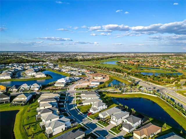 bird's eye view with a residential view and a water view