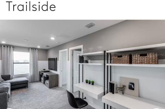 carpeted living room featuring recessed lighting and visible vents