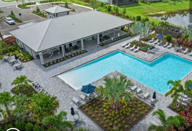 exterior space featuring a patio area and a water view