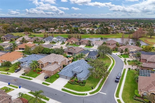 bird's eye view with a water view and a residential view