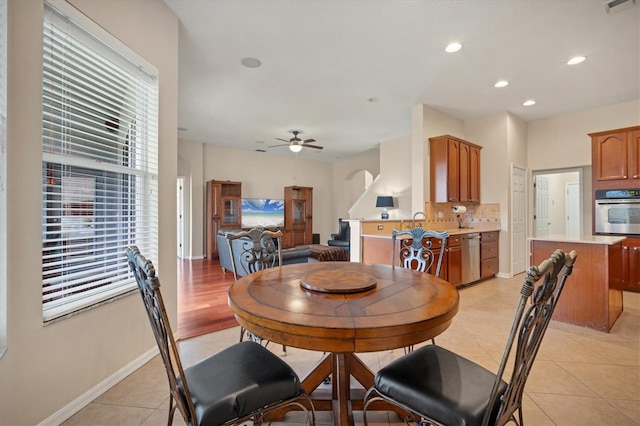 dining room with light tile patterned floors, ceiling fan, recessed lighting, visible vents, and baseboards