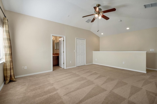 unfurnished room with lofted ceiling, baseboards, visible vents, and recessed lighting