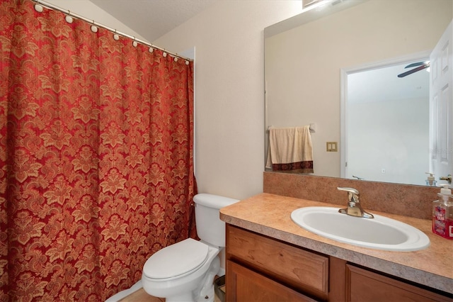 bathroom with lofted ceiling, a shower with shower curtain, vanity, and toilet