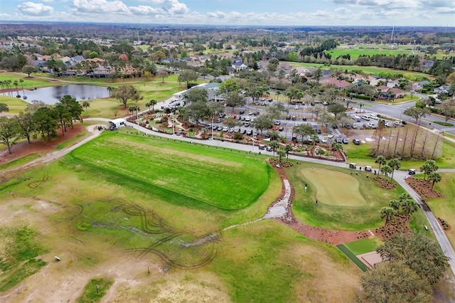 aerial view featuring golf course view and a water view