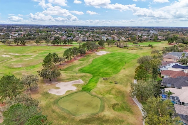 drone / aerial view featuring golf course view and a residential view