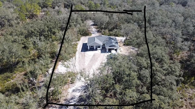 aerial view with a wooded view