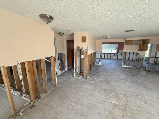 interior space featuring a textured ceiling