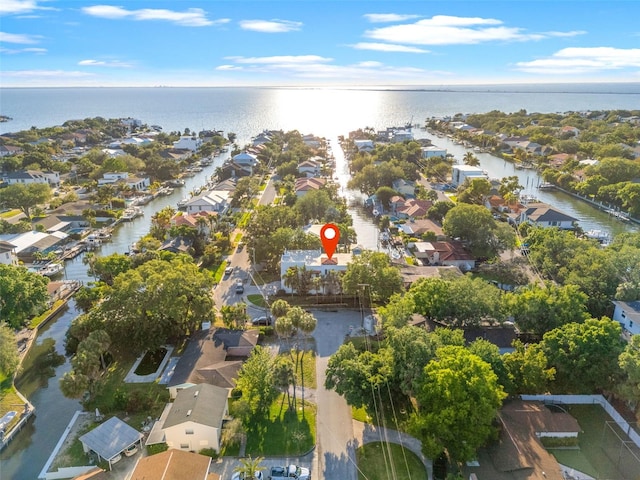 birds eye view of property featuring a water view and a residential view