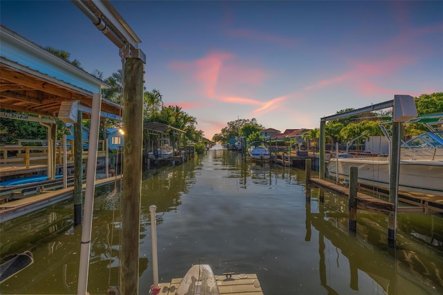 view of dock featuring a water view and boat lift