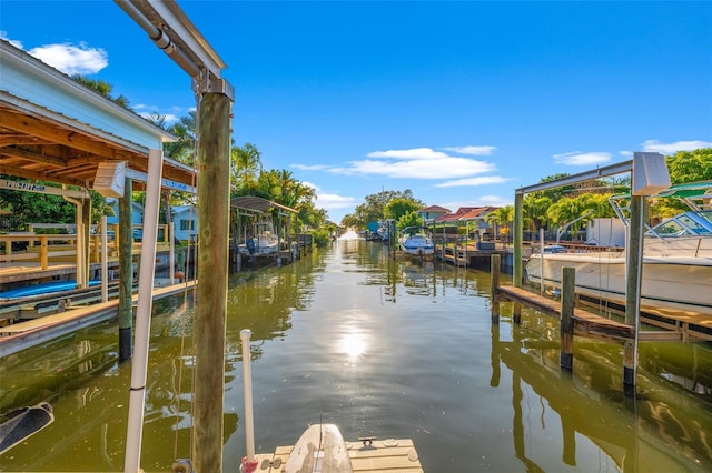 view of dock featuring a water view and boat lift