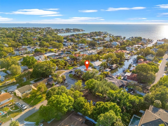 drone / aerial view featuring a water view and a residential view