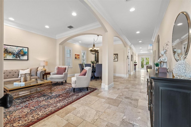 interior space with arched walkways, baseboards, stone tile floors, and recessed lighting