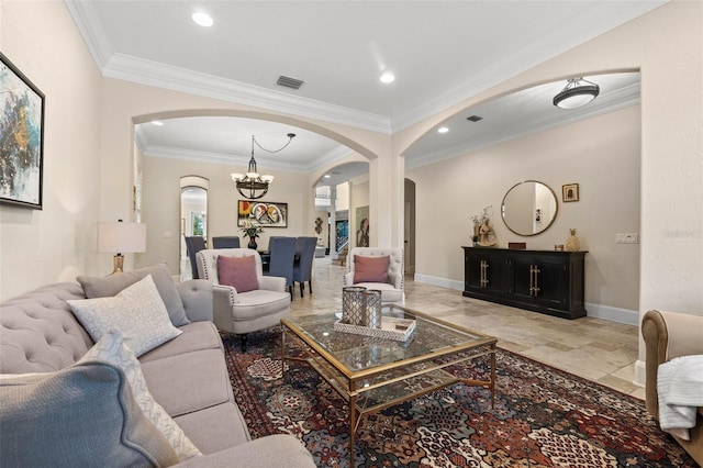 living area with arched walkways, visible vents, and baseboards