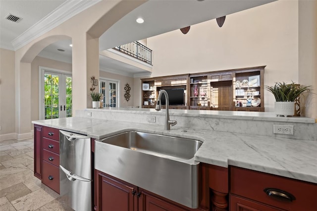 kitchen with french doors, crown molding, stone tile flooring, visible vents, and dishwasher