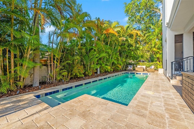 pool featuring a patio area