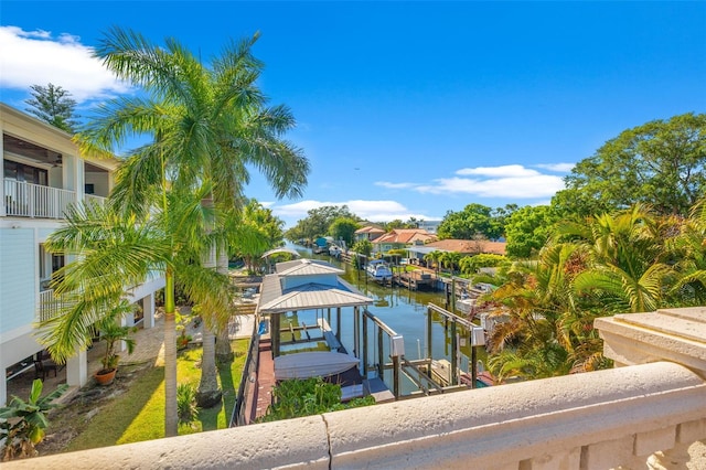 exterior space with a water view and boat lift