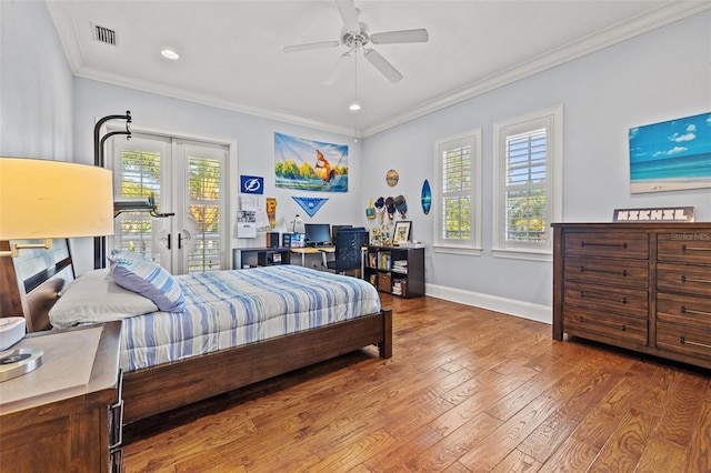 bedroom with hardwood / wood-style flooring, visible vents, access to outside, french doors, and crown molding