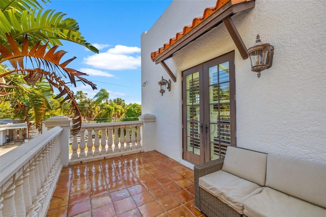 balcony featuring french doors