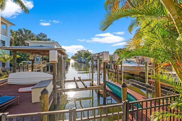 view of dock featuring a water view and boat lift