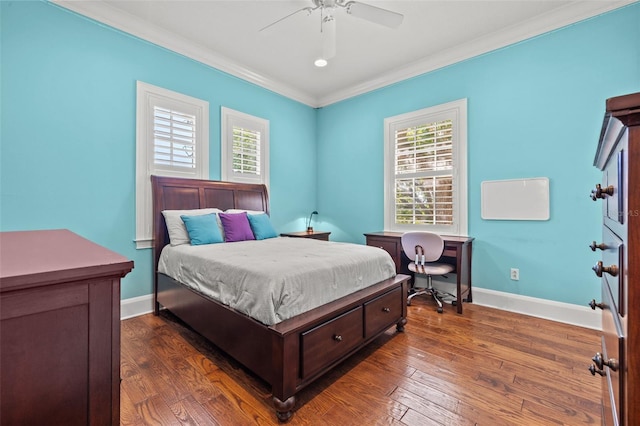 bedroom featuring dark wood-style flooring, ornamental molding, multiple windows, and baseboards