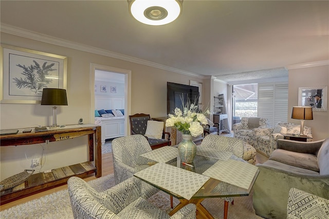 dining room with ornamental molding and wood finished floors