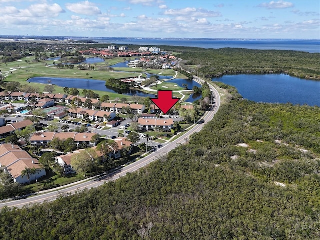 birds eye view of property featuring a residential view and a water view