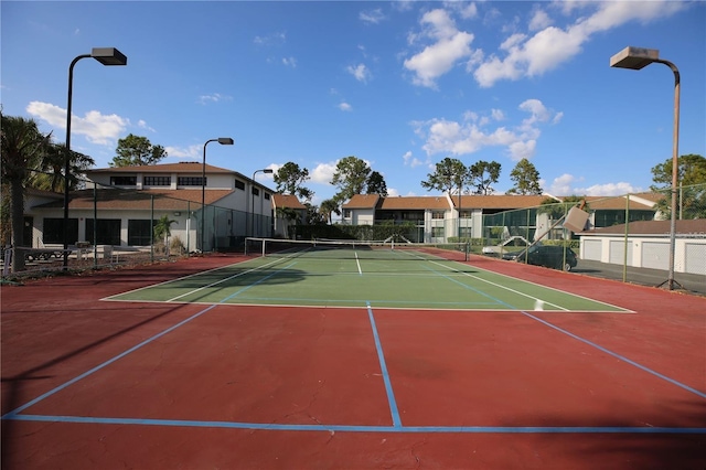 view of sport court with community basketball court and fence