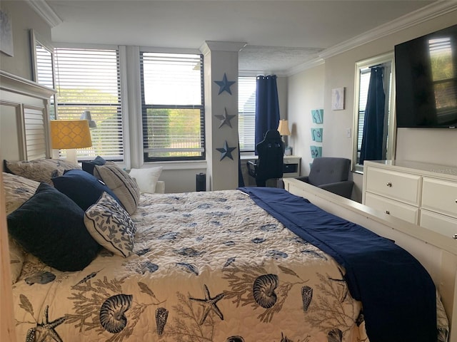 bedroom featuring multiple windows and ornamental molding