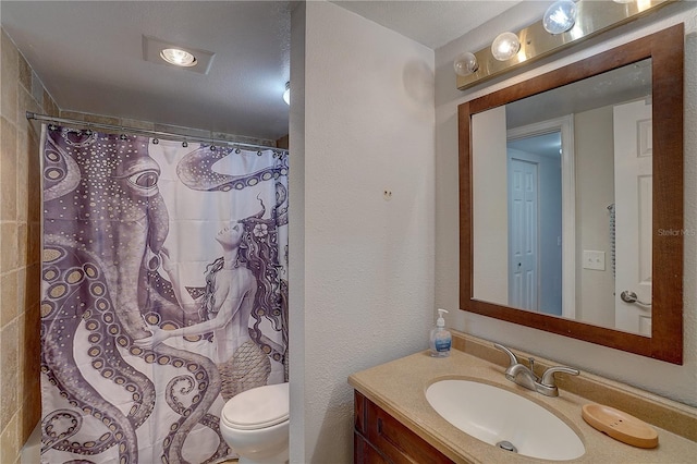 full bath with a shower with shower curtain, a textured wall, vanity, and toilet