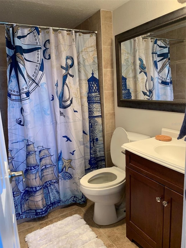 full bath with a shower with shower curtain, toilet, vanity, a textured ceiling, and tile patterned floors