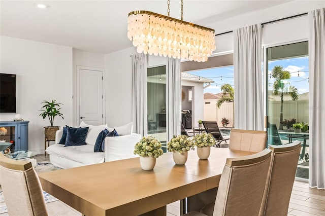 dining area featuring a chandelier and wood finished floors