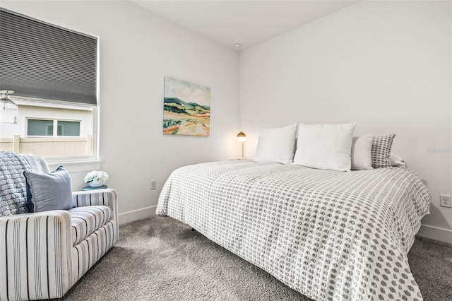 carpeted bedroom featuring baseboards