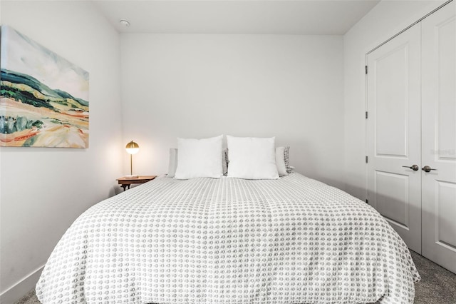 bedroom with carpet and a closet