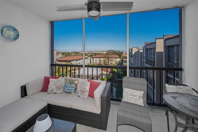 sunroom featuring ceiling fan