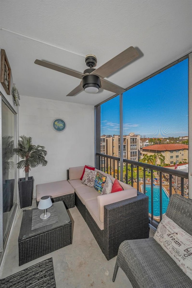 balcony with ceiling fan and an outdoor living space