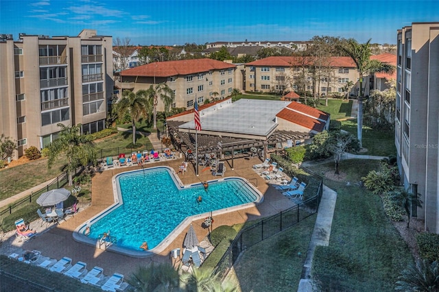 community pool featuring a patio and fence