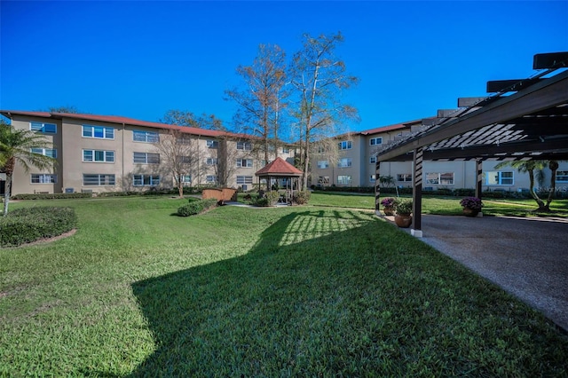 exterior space with a yard and a gazebo