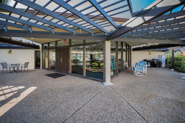 exterior space featuring outdoor dining area and a pergola