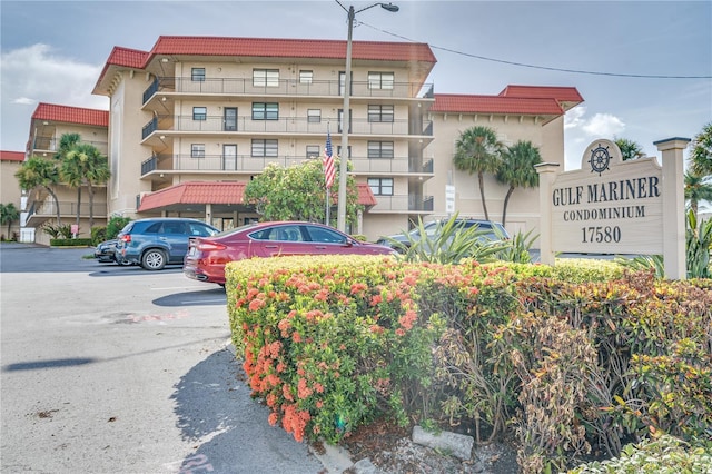 view of property featuring uncovered parking