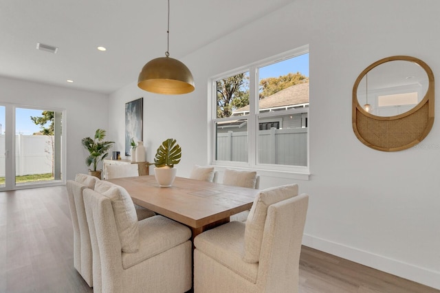 dining area with recessed lighting, visible vents, baseboards, and wood finished floors