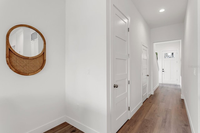 hall with recessed lighting, baseboards, and wood finished floors