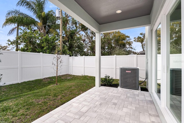 view of patio / terrace with a fenced backyard and central AC