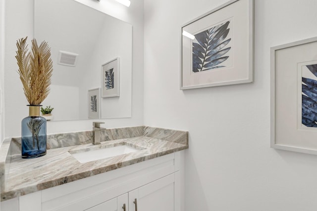 bathroom with vanity and visible vents