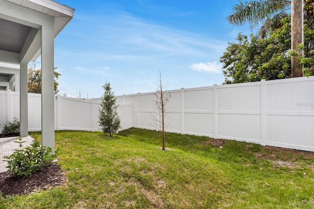 view of yard with a fenced backyard