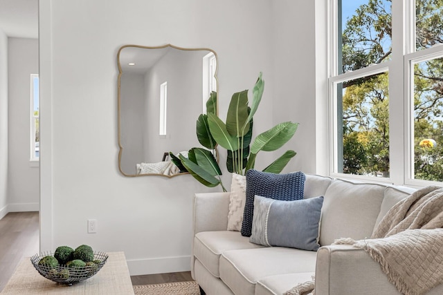 interior space with wood finished floors and baseboards